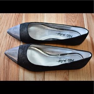 Never worn..Cute black and silver flats.
